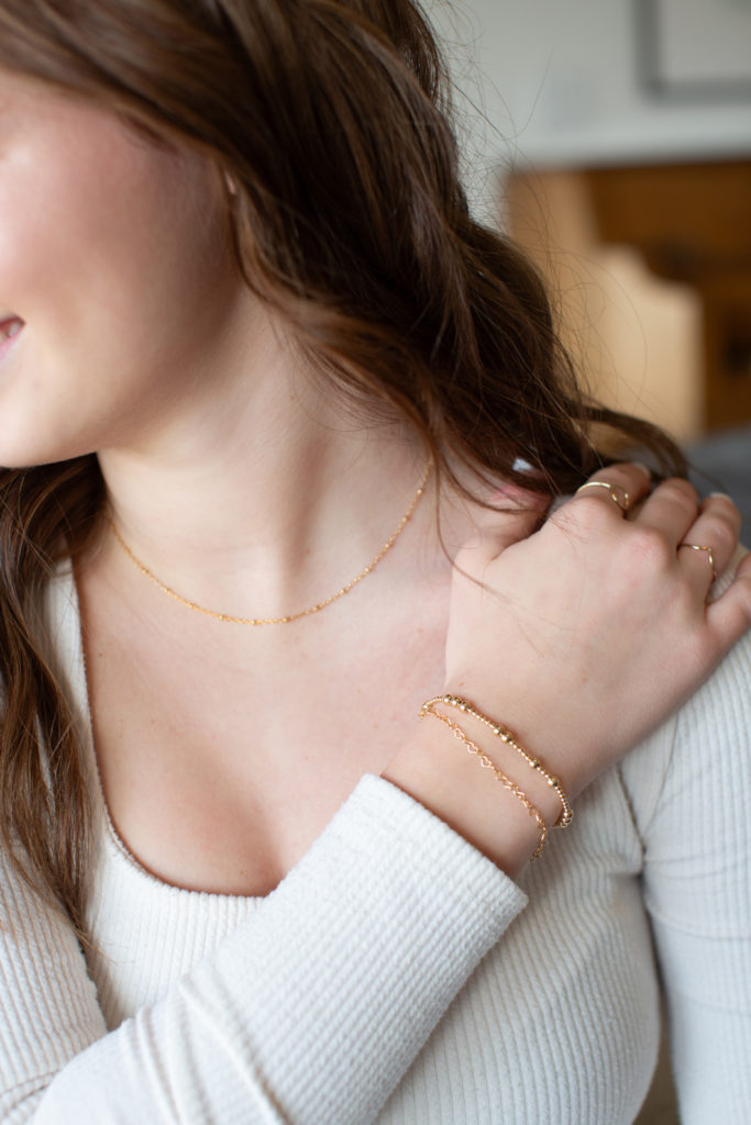 girl shows off her permanent jewelry in Alma, Michigan